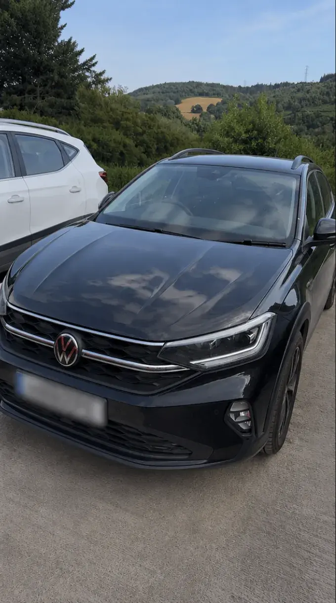 Freshly detailed black vehicle with a reflective finish